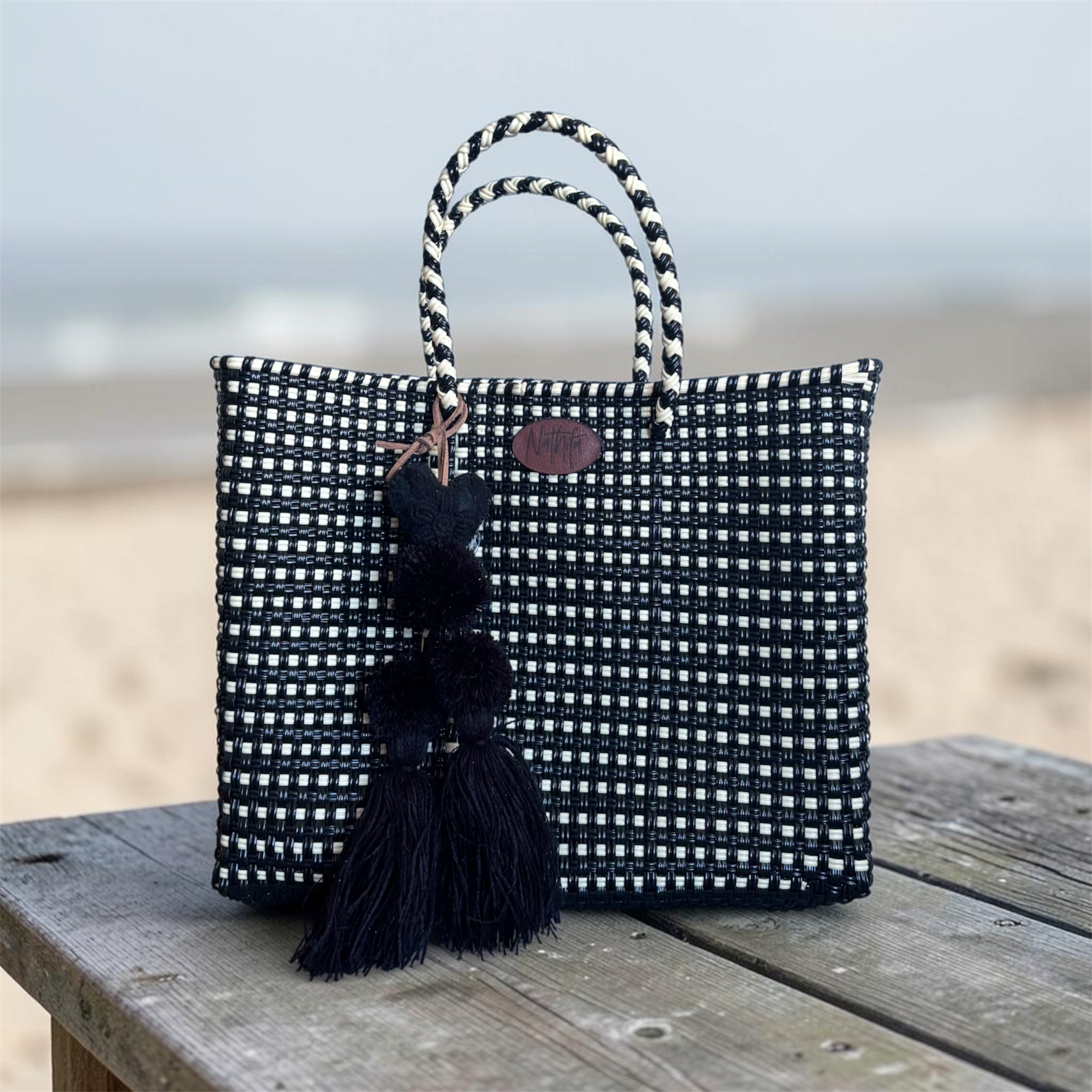Cartera tejida pequeña negro/Crema
