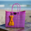Cartera tejida pequeña fucsia