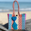 Cartera tejida mediana rayas azul/amarillo/mamey